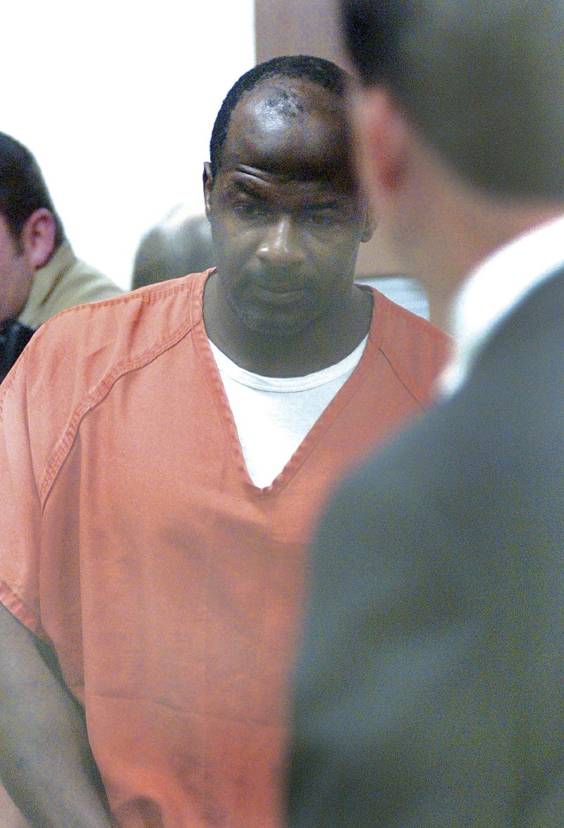 Ricky Anderson walks into the courtroom for his July 2009 arraignment at the Washington County Detention Center in Fayettevile.