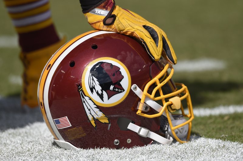 In this Sept. 18, 2016 file photo, a Washington Redskins helmet is seen on the sidelines during the first half of an NFL football game against the Dallas Cowboys in Landover, Md. The Supreme Court on Monday, June 19, 2017, struck down part of a law that bans offensive trademarks in a ruling that is expected to help the Washington Redskins in their legal fight over the team name. 