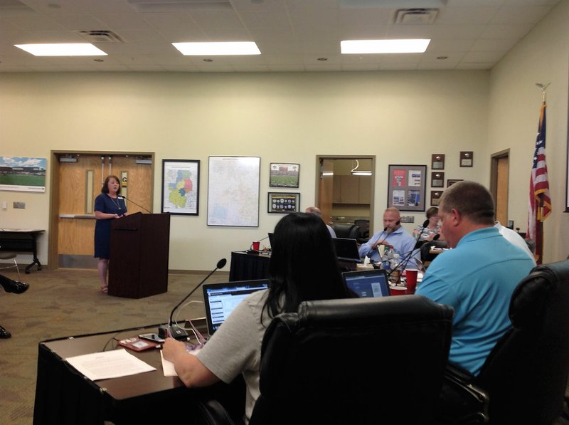 Deb Kee, director of early childhood for the Bentonville School District, addresses the School Board during its meeting Monday.