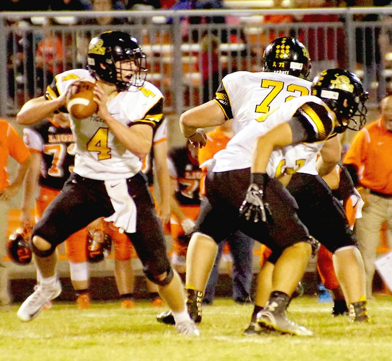 RANDY MOLL NWA NEWSPAPERS Prairie Grove senior quarterback Zeke Laird looks to pass against Gravette. Laird led the Tigers to a 35-0 road win on Sept. 30 highlighted by a 72-yard touchdown toss to Isaac Disney. Laird was honored with All-State status in football.