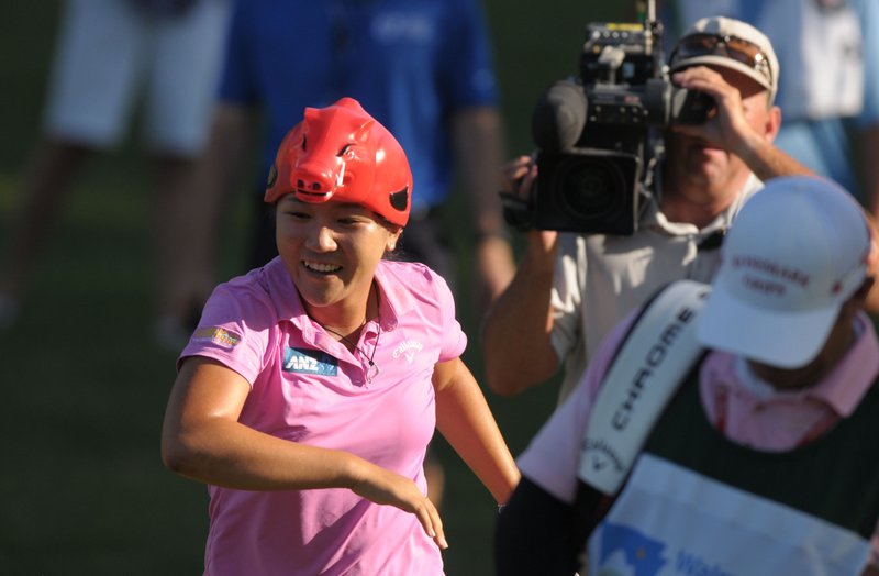 NWA Democrat-Gazette/BEN GOFF @NWABENGOFF
Lydia Ko of New Zealand sports an Arkansas Razorbacks hat as she runs up the 17th green on Sunday June 26, 2016 during the final day of the LPGA Wal-Mart NW Arkansas Championship at Pinnacle Country Club in Rogers. Ko won with a tournament record score of 17 under par. 
