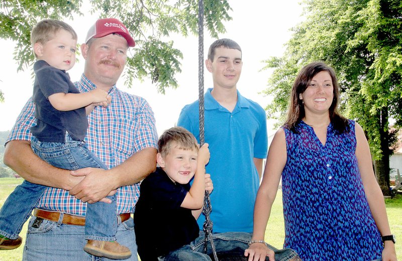 LYNN KUTTER ENTERPRISE-LEADER Allen and Cindy Moore and their sons, Cameron Harrison, Kipton Moore and Hudson Moore, were named the 2017 Washington County Farm Family of the Year. The name of the family operation is Moore Valley Farms.