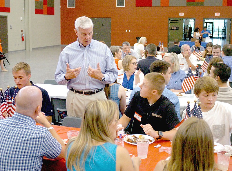 MARK HUMPHREY ENTERPRISE-LEADER U.S. Congressman Steve Womack (R-Rogers) visits with the Laird family of Prairie Grove. Womack explained to constituents some of the impact in the aftermath of an Illinois man shooting at Republican members of Congress and their staffs as they practiced for the annual Congressional Baseball Game for Charity last Wednesday.