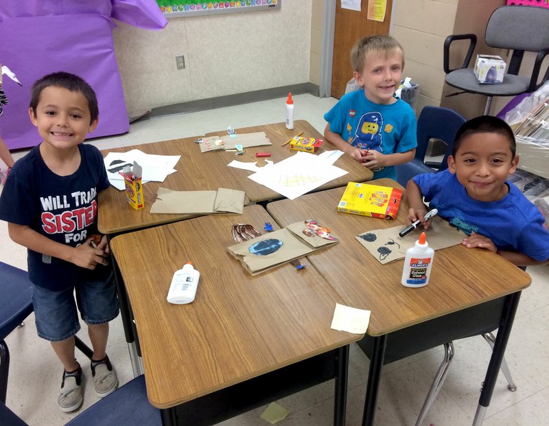 Photo by Ashley Oosterman Nathaniel Chapell (left), Kenny Mestrovich and Isaac Torres took a break from their activities to pause for a photo recently at Gravette Upper Elementary School. The boys were enjoying art enrichment classes as a part of the summer program supported by a 21st Century Community Learning Center grant.