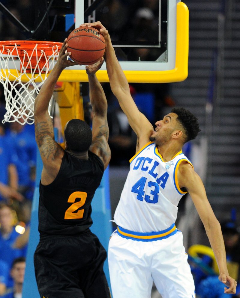 FILE - In this Jan. 9, 2016, file photo, UCLA's Jonah Bolden blocks a shot by Arizona State's Willie Atwood in the second half of an NCAA college basketball game in Los Angeles. Bolden is an Australian-born forward who played one season at UCLA, then left and has since been playing in pro leagues in Australia and Serbia. Bolden is hoping to be picked in Thursday's NBA Draft. (AP Photo/Michael Owen Baker, File)