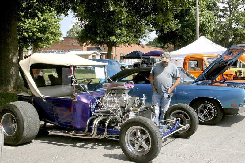 FILE PHOTO Frank Birmingham of West Fork looks over this 1923 Ford T-Bucket from the 2016 Chicken Rod Nationals Car Show in Lincoln. The sixth annual show will be 9 a.m. to 3 p.m. Saturday, June 24, on Lincoln Square.