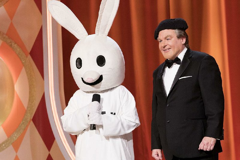 The Gong Show host Tommy Maitland introduces Snax the Funny Bunny to the audience.
