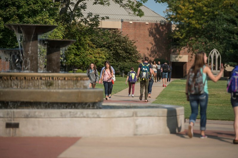 Students walk on campus Wednesday, Aug. 26, 2015 near the fountain in front of the Cathedral of the Ozarks at John Brown University in Siloam Springs. It was the first day for classes at the school. 