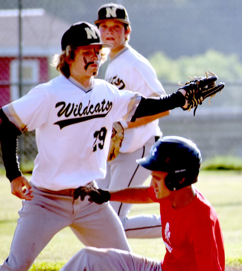 Photo by Rick Peck McDonald County&#8217;s Koby McAlister slides into second base ahead of a throw during McDonald County&#8217;s 9-1 loss on June 13 at McDonald County High School.