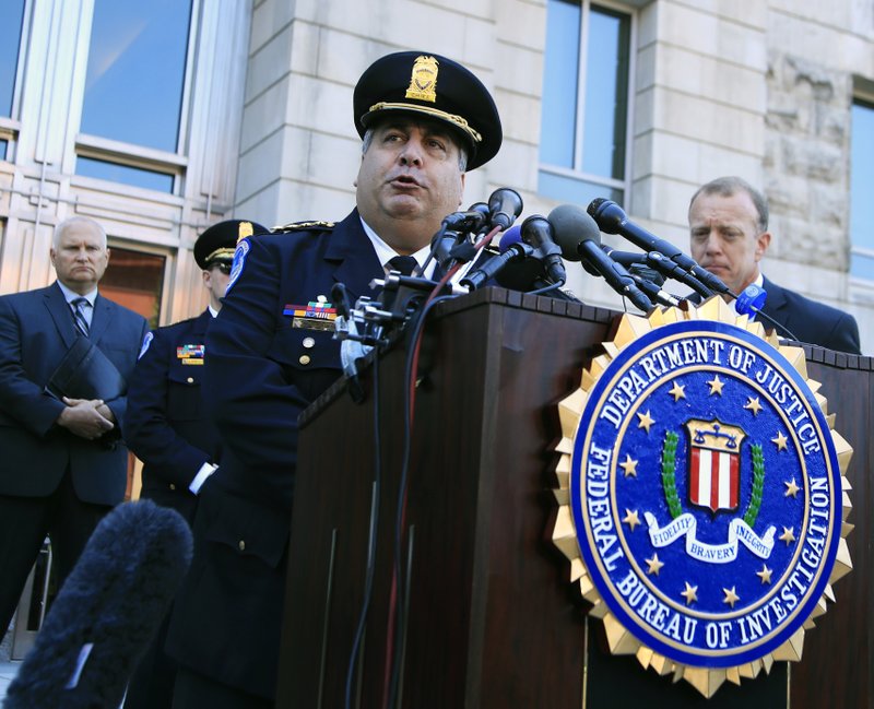 United States Capitol Police Chief Matthew Verderosa, with Federal Bureau of Investigation Washington Field Office, Special Agent in Charge Timothy Slater, back right, speaks to reporters outside the FBI Washington Field Office, Wednesday, June 21, 2017 in Washington, during a news conference about the investigative findings to date in the shooting that occurred at Eugene Simpson Stadium Park in Alexandria, Va. on Wednesday, June 14, 2017. (AP Photo/Manuel Balce Ceneta)