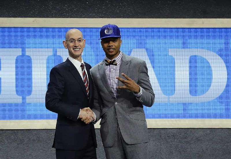 Markelle Fultz acknowledges the University of Washington by gesturing a “W” after he was selected by Philadelphia as the No. 1 pick in the NBA draft Thursday. Fultz is the fourth consecutive freshman to be selected as the top overall pick.