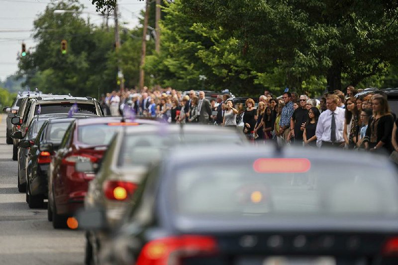 Mourners line the street after the funeral of Otto Warmbier on Thursday in Wyoming, Ohio.