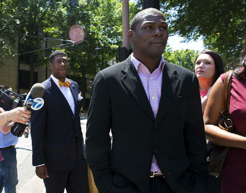 FILE — Jermain Taylor leaves the Pulaski County Court House with members of his council after being ordered to 6 years of a suspended sentence in a trio of felony cases May 20, 2016. 