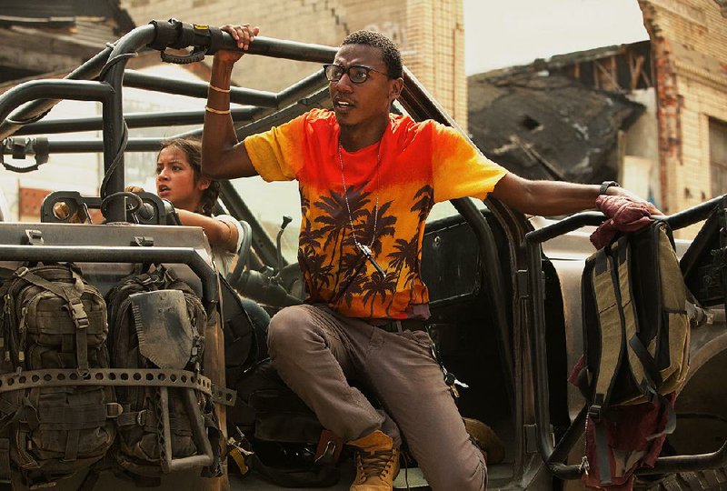 Feisty Izabella (Isabela Moner) and comic relief Jimmy (Jerrod Carmichael) are attacked by Megatron’s minions in Transformers: The Last Knight, the fi fth and (allegedly) last movie in the series that will be directed by Michael Bay.