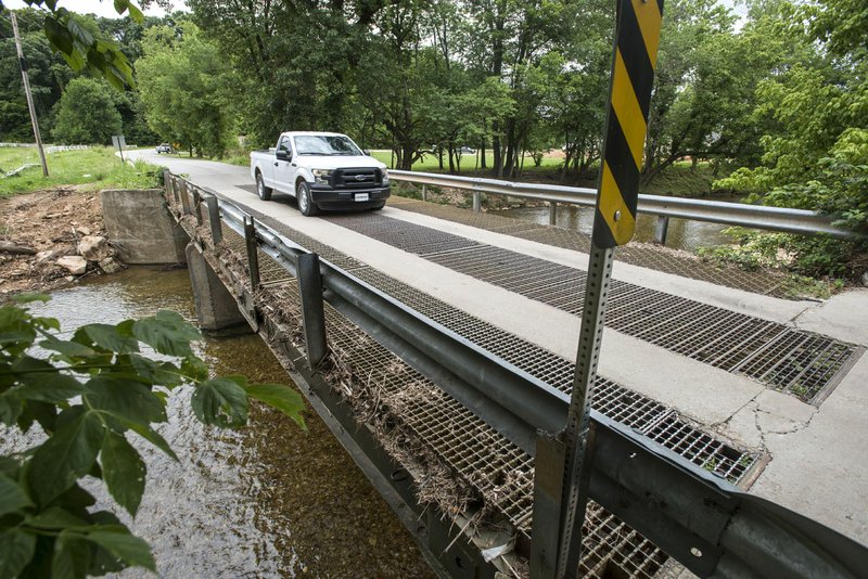 NWA Democrat-Gazette/SPENCER TIREY A truck crosses the one lane bridge Thursday on Wagon Wheel Road. Benton County is seeking federal grant money through the Northwest Arkansas Regional Planning Commission to offset a $1 million project to replace the bridge.