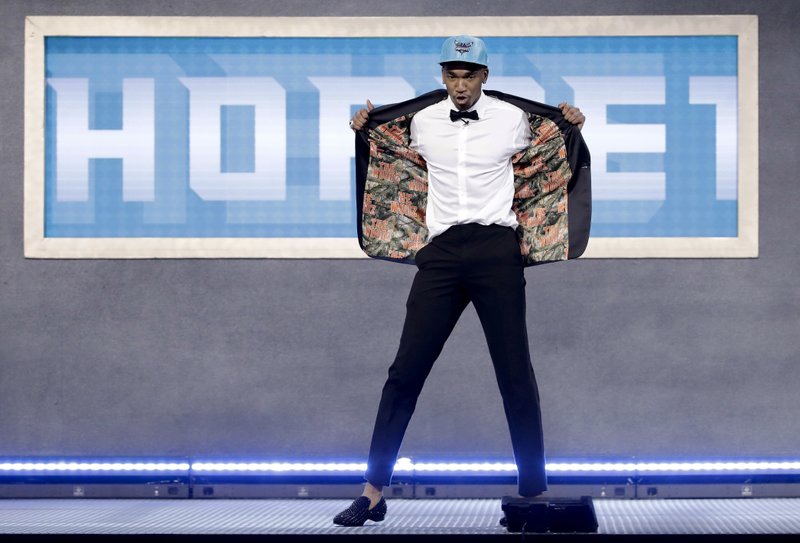 Kentucky's Malik Monk reacts after being selected by the Charlotte Hornets as the 11th pick overall during the NBA basketball draft, Thursday, June 22, 2017, in New York. (AP Photo/Frank Franklin II)