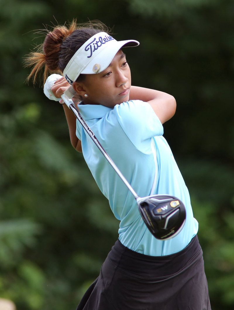 Zoe Antoinette Campos watches her first drive Thursday as she participates in the KPMG Stacy Lewis Junior
All-Star Invitational at the Fayetteville Country Club.