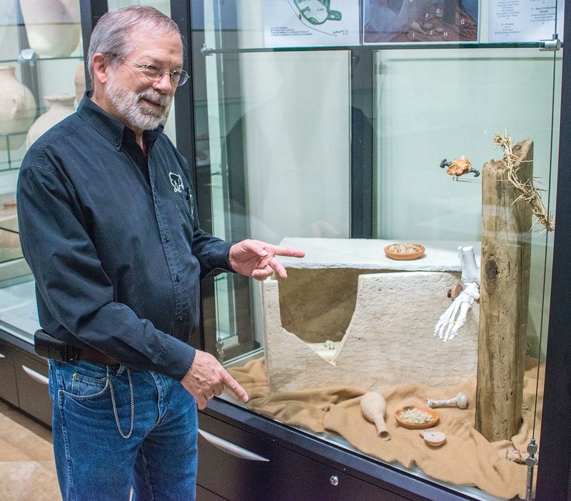 Dale Manor explains some of the artifacts in the Linda Byrd Smith Museum of Biblical Archaeology at Harding University in Searcy. Manor uncovered many of the artifacts housed in the museum on trips to the Tel Beth-Shemesh dig site in Israel.