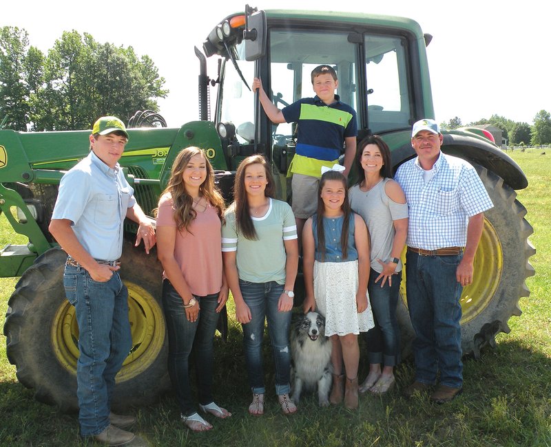 The Chris Tharp Family of Floral has been named the North Central District Farm Family of the Year for 2017.
Family members include, front row, from left, Colton, Ainsley, Kylie, Lily, mom Heather and dad Chris Tharp. Reese is standing on the tractor. 