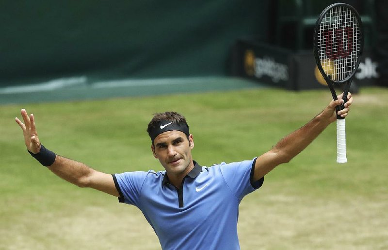 Switzerland's Roger Federer celebrates after beating Germany's Florian Mayer in the quarterfinal of the ATP tournament in Halle, Germany, Friday, June 23, 2017. 