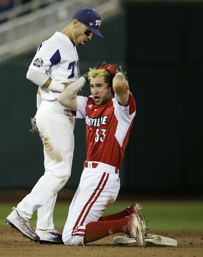 Louisville base runner Ryan Summers (right) reacts after being called out at second while TCU shortstop Ryan Merrill looks on during the Horned Frogs 4-3 victory in Thursday night’s late game at the College World Series.