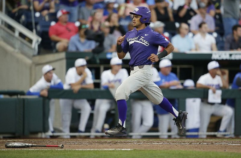 TCU’S Elliott Barzilli heads home during the fourth inning of Friday’s late game at the College World Series in Omaha, Neb. The Horned Frogs staved off elimination by beating Florida 9-2 to force a rematch today at 7 p.m.