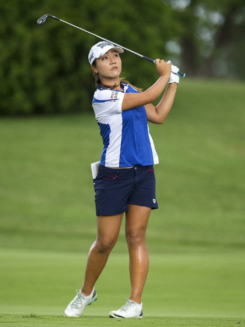 Lydia Ko, defending her title at the Northwest Arkansas Championship, finished with a 1-under 70 and finished a wind-blown ÿrst round seven shots behind leader Sung Hyun Park.