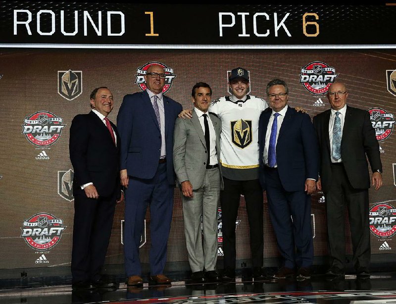 Cody Glass (third from right) was chosen sixth Friday in the first round of the NHL draft by the expansion Vegas Golden Knights in Chicago.
