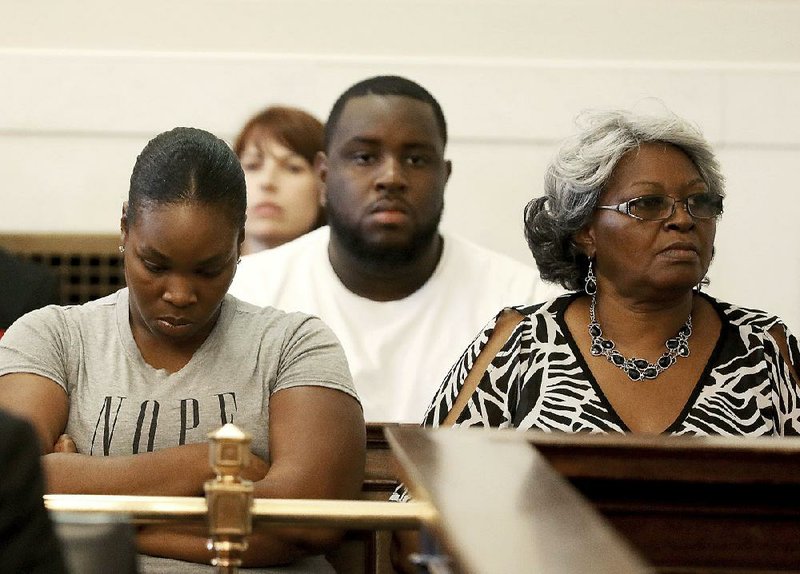 Audrey DuBose (right), mother of officer-slain Sam DuBose, looks at the jury Friday as Judge Leslie Ghiz declares a mistrial in officer Ray Tensing’s retrial in Cincinnati.