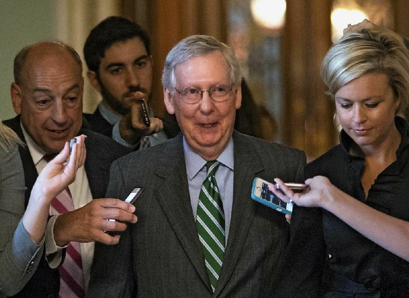 Senate Majority Leader Mitch McConnell leaves the chamber after announcing the release of the Senate Republicans’ health care bill Thursday at the Capitol in Washington.