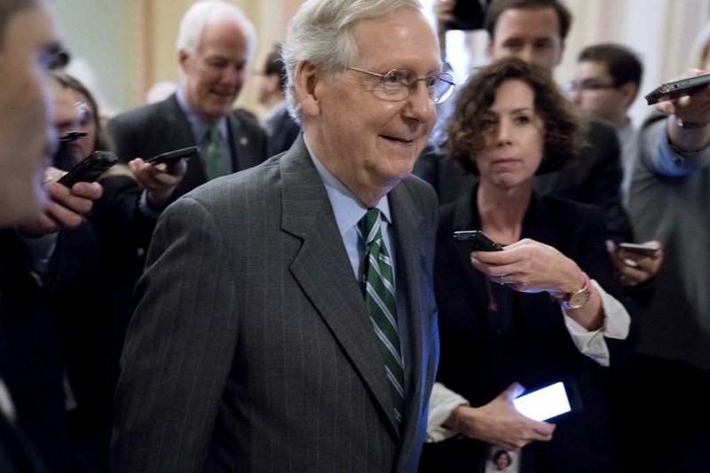 Senate Majority Leader Mitch McConnell of Ky. walks on to the Senate floor on Capitol Hill in Washington, Thursday, June 22, 2017, following a meeting with Senate Republicans on a health reform bill. Senate Republicans would cut Medicaid, end penalties for people not buying insurance and erase a raft of tax increases as part of their long-awaited plan to scuttle Barack Obama's health care law. (AP Photo/Andrew Harnik)