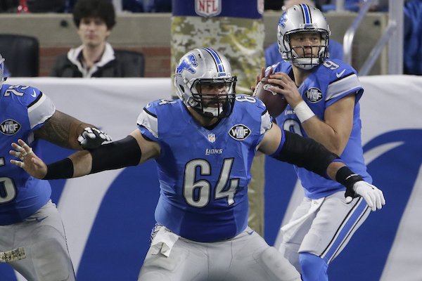 Detroit Lions center Travis Swanson (64) protects quarterback Matthew Stafford (9) during the first half of an NFL football game against the Jacksonville Jaguars, Sunday, Nov. 20, 2016 in Detroit. (AP Photo/Duane Burleson)