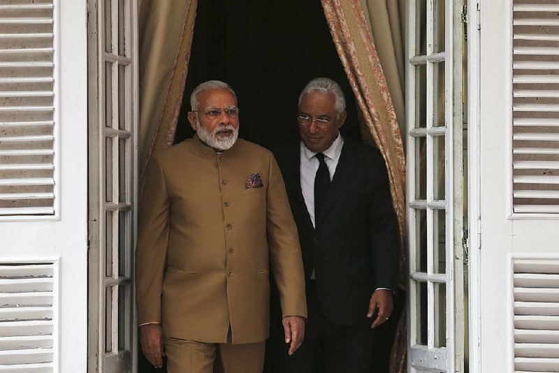 India's Prime Minister Narendra Modi, left, and Portuguese Prime Minister Antonio Costa leave after a meeting at the Necessidades Palace, the Portuguese Foreign Ministry in Lisbon, Portugal, Saturday June 24, 2017.