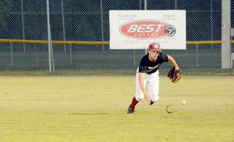 Michael Burchfiel/Siloam Sunday Right fielder Nolan Wallis chased down a fall in the outfield during Siloam Springs&#8217; 5-5 tie to RBI Baseball Academy Wednesday.