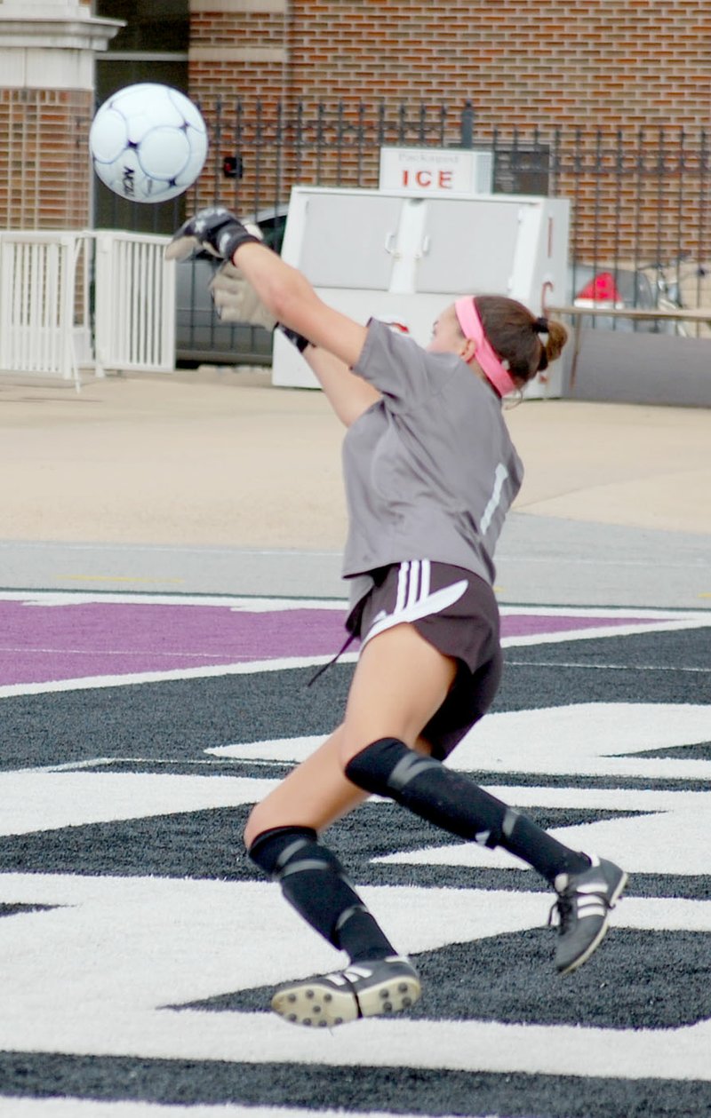 Graham Thomas/Siloam Sunday Former Siloam Springs standout Anna Claire Lewis makes a save diving to her right after a shot by Bryant&#8217;s Caroline Campbell in the first half of the Arkansas High School Coaches Association All-Star Girls Soccer Game on Wednesday at Estes Stadium on the campus of the University of Central Arkansas in Conway.