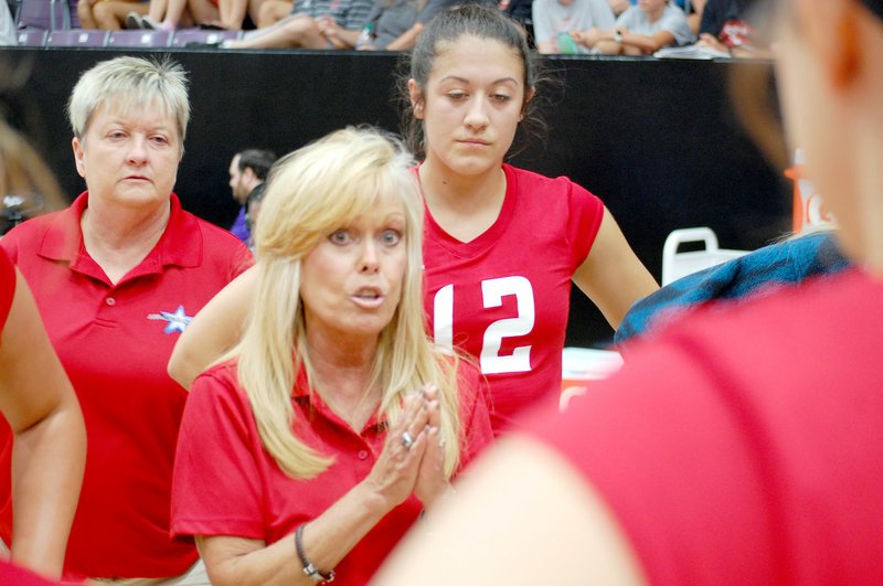 Graham Thomas/Siloam Sunday West All-Star head coach Rose Cheek-Willis of Siloam Springs gives insturctions during a timeout Wednesday in the Arkansas High School Coaches Association All-Star Volleyball game held at the Farris Center on the campus of the University of Central Arkansas in Conway. Cheek-Willis and the West team rallied from a 2-0 deficit to defeat the East 3-2.