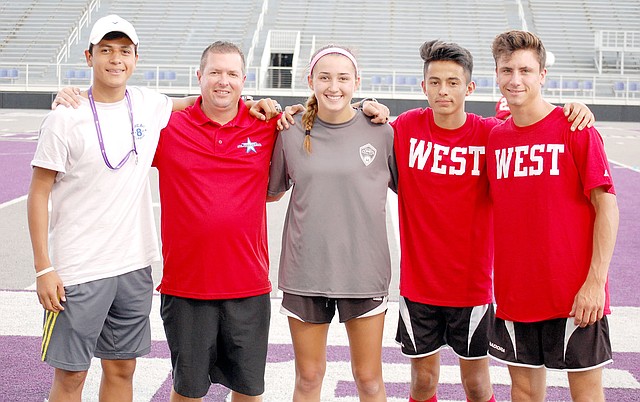 Graham Thomas/Siloam Sunday The Siloam Springs High School soccer program was well-represented this past week at the Arkansas High School Coaches Association All-Star Week in Conway. Pictured from left, are manager Christian Marroquin, West boys head coach Brent Crenshaw, West girls goalkeeper Anna Claire Lewis and West boys players Francisco Sifuentes and Austin Shull.