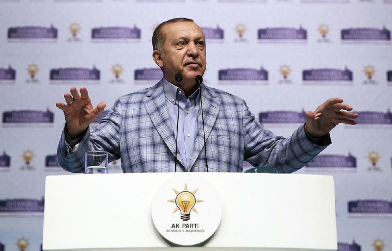 Turkey’s president and leader of the ruling Justice and Development Party, Recep Tayyip Erdogan, addresses party members in  Istanbul on Sunday.