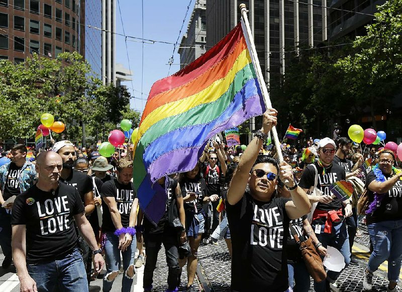Marchers take part in the Pride parade in San Francisco on Sunday.