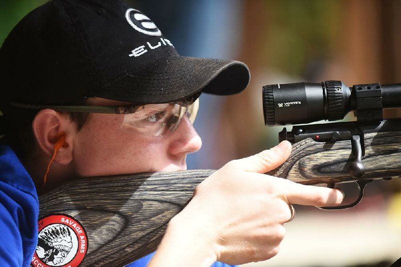 Ryan Lane shoots Saturday at an Ozark Youth Shooting Team practice near Bentonville. Lane, a team member, shoots a .22-caliber rifle here but will shoot an air gun at the Daisy National BB Gun Championship Match in Rogers this weekend.