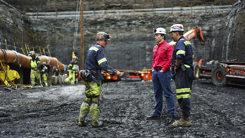 Corsa Chief Executive Officer George Dethlefsen, in red, talks to workers at a new Corsa coal mine in Friedens, Pa. The world’s biggest coal users — China, the United States and India — have increased coal mining this year.