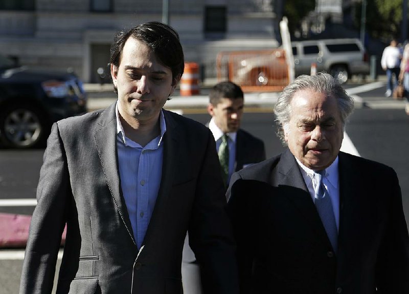 Former Turing Pharmaceuticals Chief Executive Officer Martin Shkreli (left) arrives Monday at federal court in New York with his attorney Benjamin Brafman.