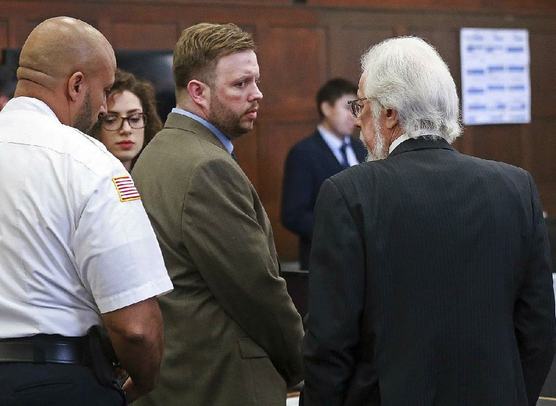 Michael McCarthy looks at his attorney Jonathan Shapiro after he was found guilty of second-degree murder Monday at Suffolk Superior Court in Boston.