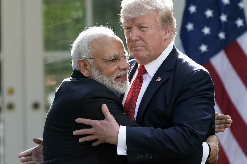 President Donald Trump and Indian Prime Minister Narendra Modi embrace while making statements in the Rose Garden of the White House on Monday.