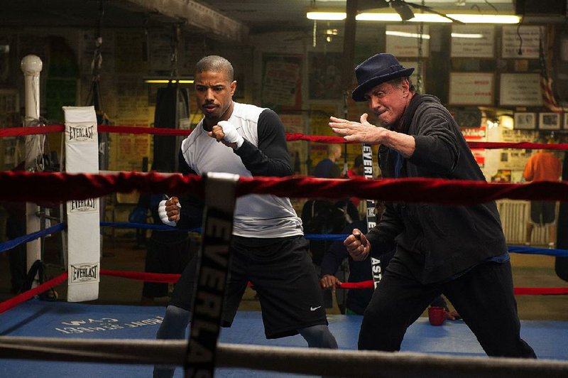 Sylvester Stallone (right) returns as Rocky Balboa, with Michael B. Jordan as his protege, Adonis Johnson, in Creed.