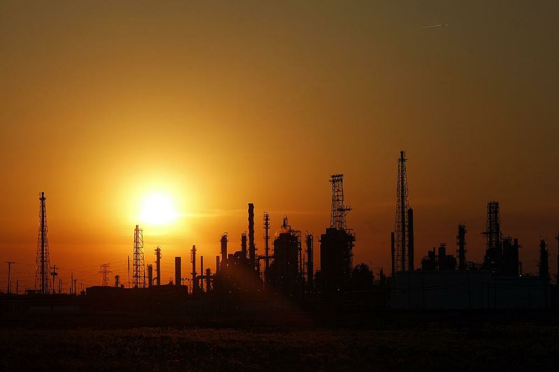 The sun sets behind the BP-Husky Toledo Refinery in Oregon, Ohio, on June 13. Mexico relies on U.S. natural gas to fuel more than a quarter of its electricity production, but the market faces disruption if there is a renegotiation of the North American Free Trade Agreement. 