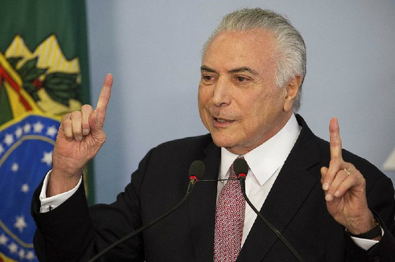 Brazil's President Michel Temer makes a statement at the Planalto Presidential Palace, in Brasilia, Tuesday, June 27, 2017.
