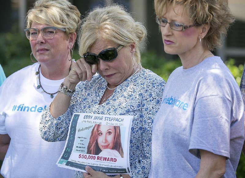 FILE — Laurie Jernigan (center), mother of missing teen Ebby Steppach, wipes tears while announcing a $50,000 reward for information about her daughter’s disappearance during a news conference at the Little Rock Police Department in June 2017. With her are Melissa Holman (left) and Tonya Crandall.