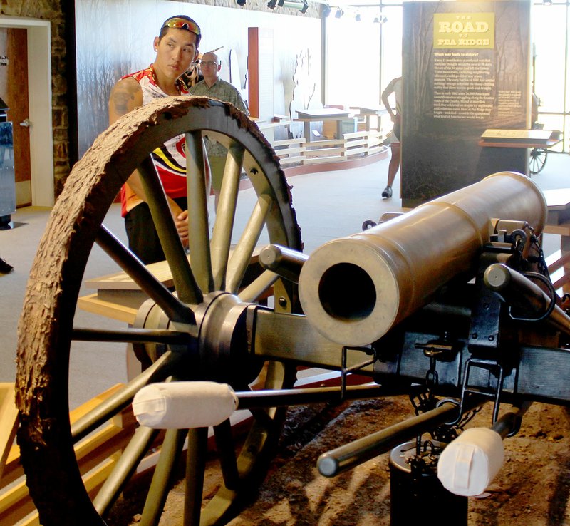 Keith Bryant/The Times of Northeast Benton County
Tahlequah resident Ellic Miller looks at a cannon exhibit at Pea Ridge National Military Park. 