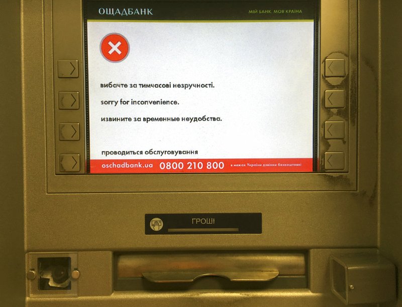 A screen of an idle virus affected cash machine in a state-run OshchadBank says "Sorry for inconvenience/Under repair" in Kiev, Ukraine, on Wednesday, June 28, 2017.
